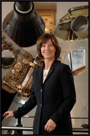 Dr. Bonnie J. Dunbar in front of the Apollo Command Module.
