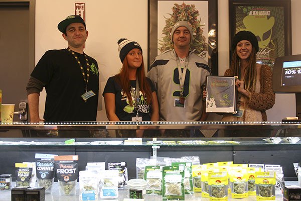 Employees at Herbal Nation showcase their wares.
