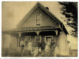 A picture of the Bartelson Home with its original inhabitants