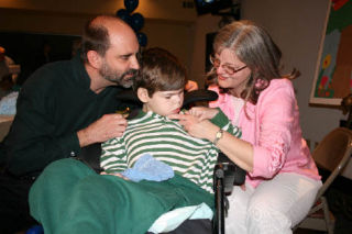 Dan and Pam Garries with son Matthew during an April 21 dessert auction at Northshore Baptist Church. The event raised $8