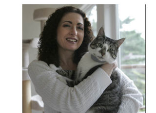 Monique Kebbe holds one of her cats