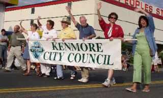 Top left: Kenmore Police Chief Cliff Sether barbecues during the city’s National Night Out event in 2007. Top right: A runner participates with child in the 2006 Good Ol’ Days Fun Run. Above: Members of the first Kenmore City Council march in the 2003 Good Ol’ Days parade.