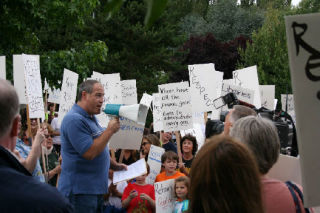 Northshore Education Association President Tim Brittell addresses picketers Aug. 20 outside the Northshore School District headquarters. For updates and past articles on contract negotiations between the school district and teachers union