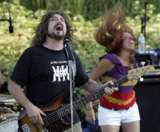 Seattle-area band Magic Bus gets its groove on Aug. 22 at the Park at Bothell Landing. The rock band played the gig in honor of Magic Bus guitarist Joe Shikany