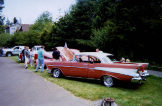 Car fans check out a 1957 Chevy at the Father’s Day Car Show at Bothell’s Country Village.