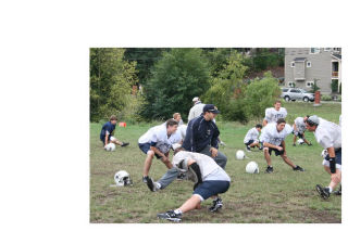 First-year Cedar Park Christian football coach Craig Shetterly leads his players through stretches during practice last Wednesday. The Eagles open their season at 7 p.m. Sept. 5 against South Whidbey at Lake Washington High.