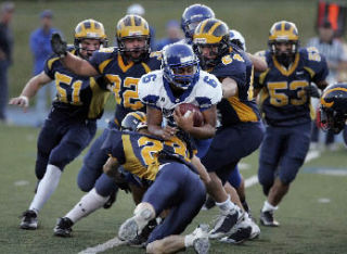 Bellevue High defenders chase down Bothell High’s Patrick Ottorbech Sept. 12.