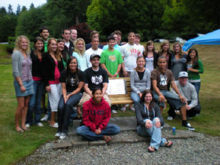 The family and friends of Inglemoor High graduate Steven Rhone Jr. gathered Aug. 19 to dedicate a bench overlooking the community basketball court on English Hill where he grew up playing ball with his friends. Rhone was killed by a drunk driver June 2