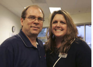 American Family Insurance agent Rae Ann Hall and her husband Russ at the Oct. 9 open house in her new office on Bothell-Everett Highway.