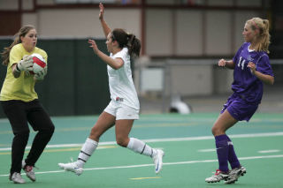 Inglemoor forward Amanda Hall charges towards the ball as Lake Washington’s goal keeper makes a save during the Oct. 7 matchup between the two schools at Pop Keeney field.