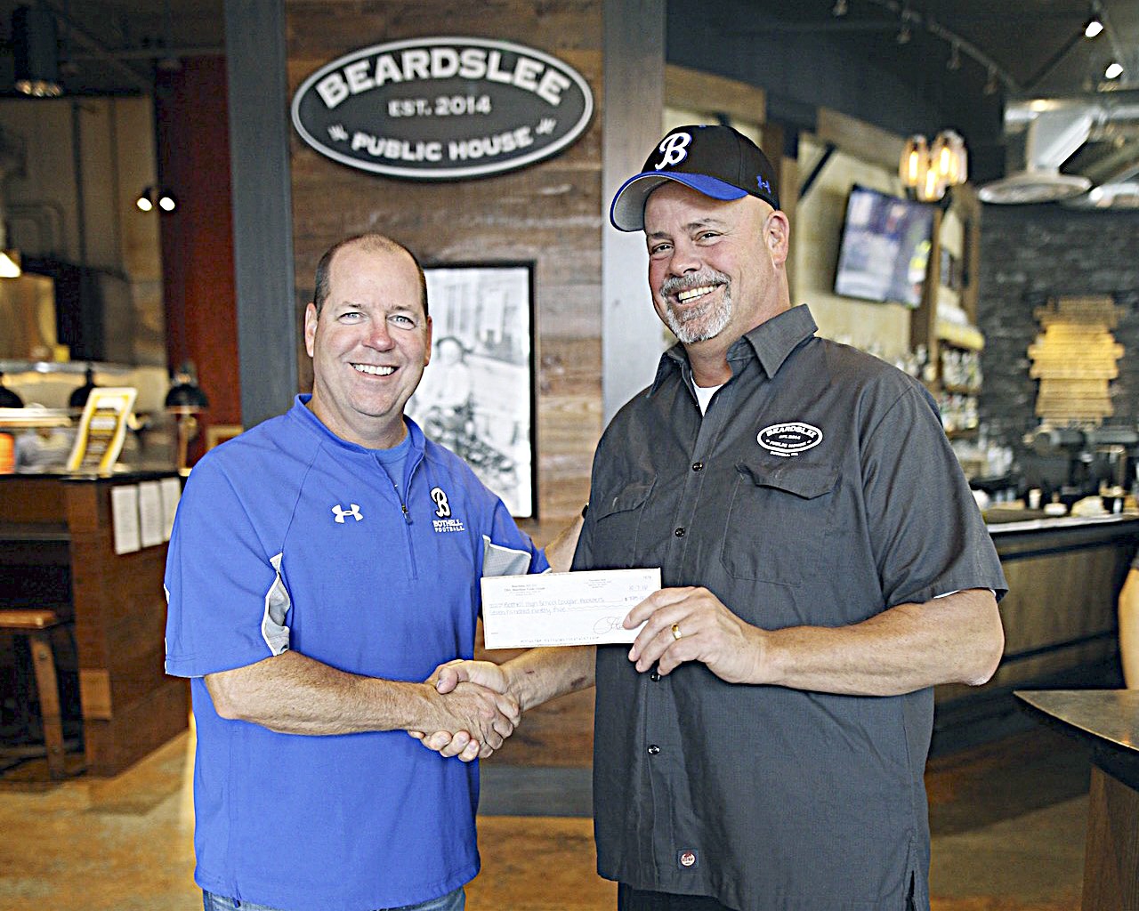 Bothell High School football coach Tom Bainter, left, and Chef John Howie. Contributed photo