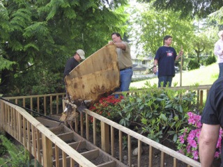 Neighbors help rebuild Bob Webster’s wheelchair ramp.