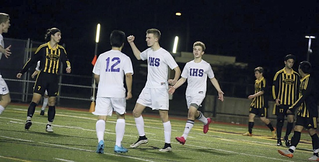 Issaquah High School boys soccer players celebrate the game-winning goal against Inglemoor on Friday. Photo courtesy of Don Borin/Stop Action Photography