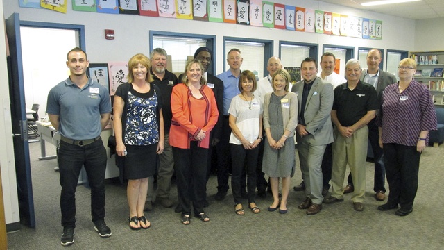 A group of Bothell business leaders and teachers helped Bothell High School students prepare for job interviews. From front left: Ben Moore