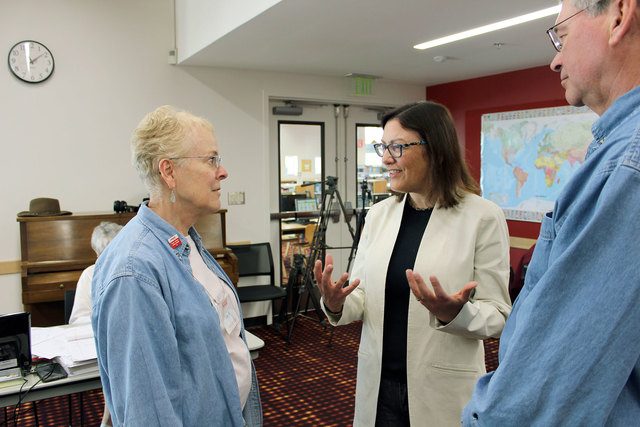 Congresswoman Suzan DelBene (WA-01) speaks with an AARP volunteer during Friday’s tax clinic at the Bothell Library for low- to moderate-income seniors ahead of the April 18 tax filing deadline. Contributed photo