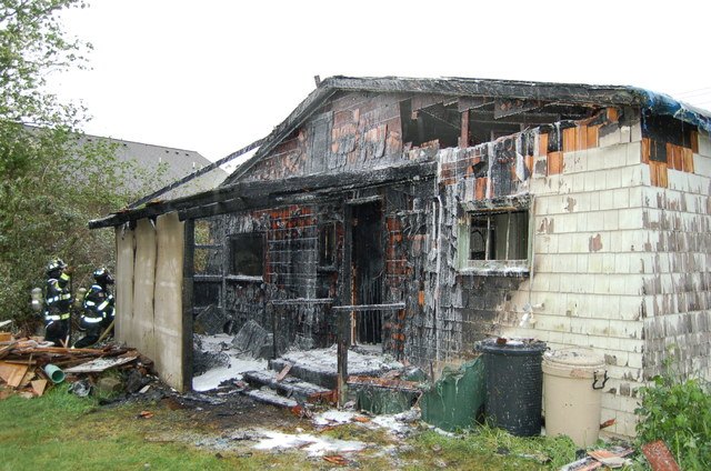 Firefighters inspect a house that was destroyed by a fire in the 7000 block of Northeast 182nd Street in Kenmore. Contributed/Northshore Fire Department