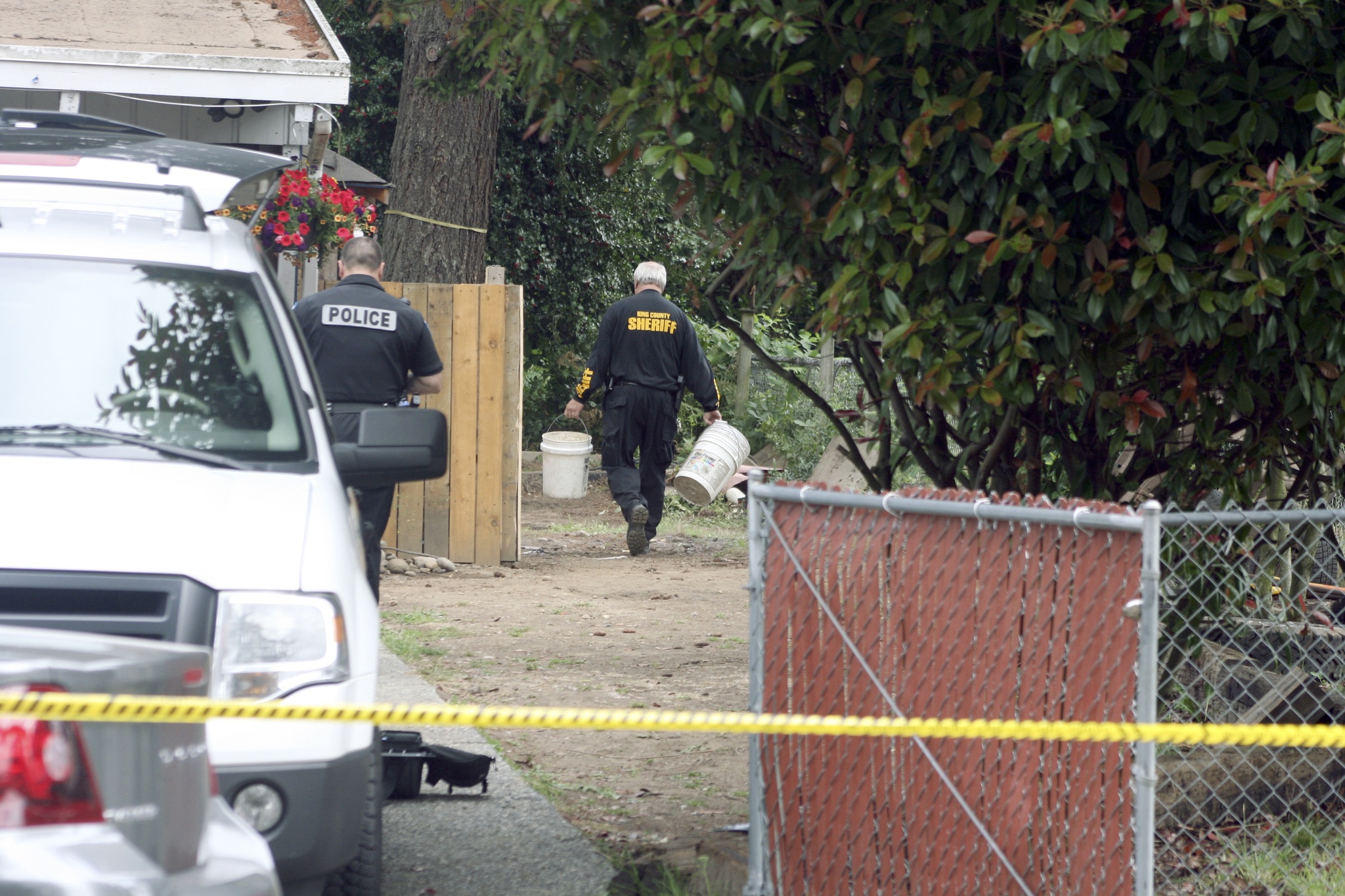 King County Sheriff's deputies search the back yard of a home on the Kenmore and Kirkland boundary for clues as to the whereabouts of Jammie Haggard
