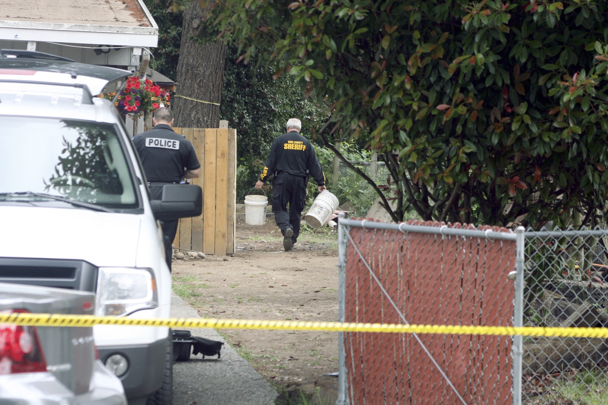 King County Sheriff's deputies search the back yard of a home on the Kenmore and Kirkland boundary for clues as to the whereabouts of Jammie Haggard