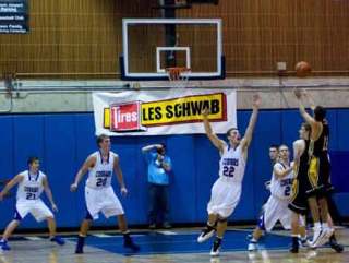 Inglemoor High’s Benji Bryant (far right) unleashes the game-winning shot against Bothell High Dec. 30 at Bellevue Community College.