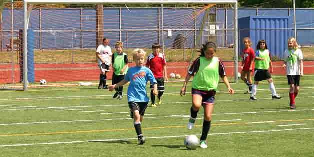 Cougar Soccer Camp players participate in a “World Cup” match last week at Bothell High.
