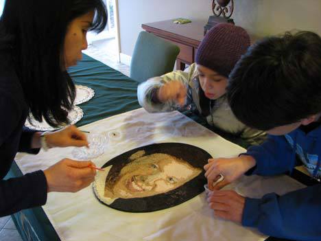 Lissa Chan and her children decorate husband and dad Jeffrey O’Rourke’s floragraph last Saturday.