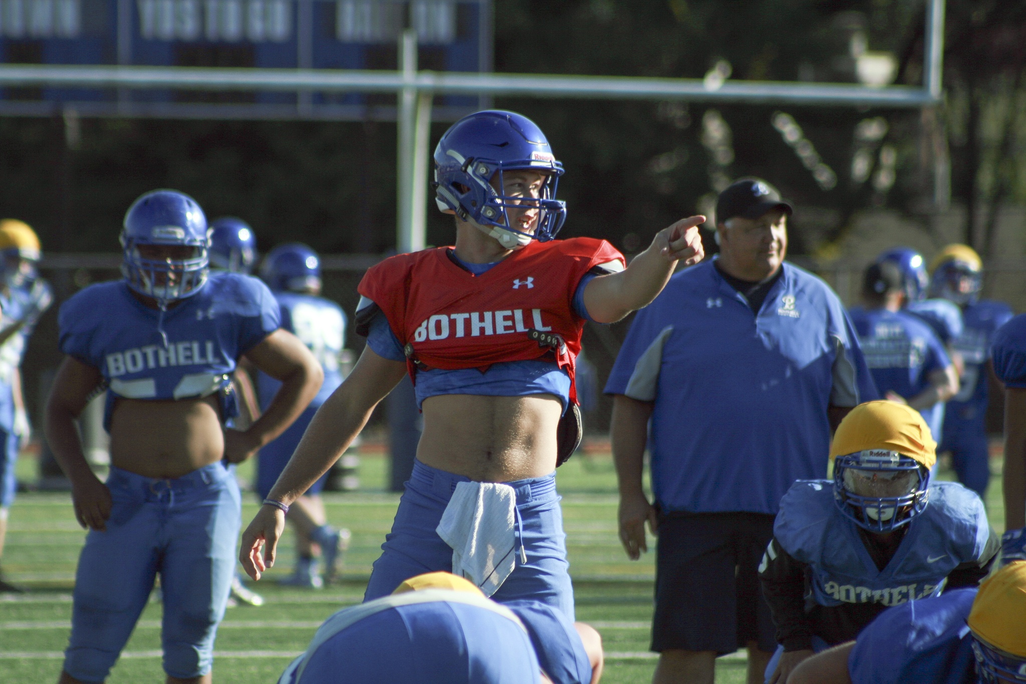 Bothell junior quarterback Jacob Sirmon directs players during practice on Aug. 22. Sirmon said he is an entirely different quarterback with a year of experience under his belt. For the full Bothell High School football preview story