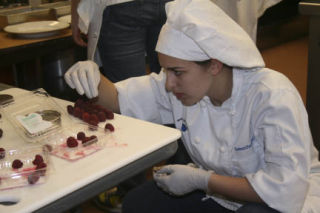 Bothell High culinary-arts student Samantha Levell assembles a chocolate and raspberry dessert for the school’s entry into a state cooking competition. TOM CORRIGAN