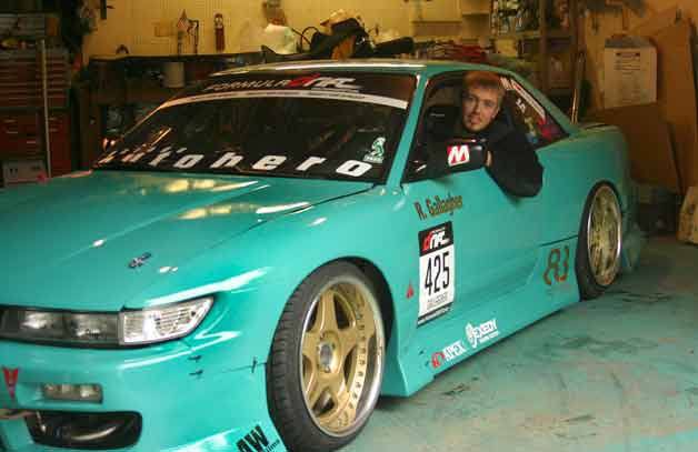 Roland Gallagher looks out from the driver’s side of his Nissan 240 SX.