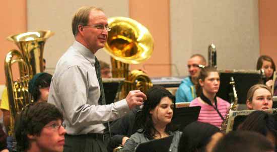Inglemoor High student musicians listen to longtime director Jim Rice’s tips during class last Friday.