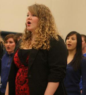 Aly Henniger and her classmates warm up their voices at the start of their Bothell High choir class Tuesday morning.