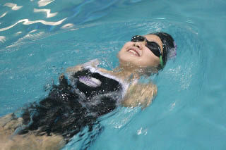 Sisters Ira and Lan Fen Kaplan of Northshore-based WAVE Aquatics each had several personal records at the Paralympic Trials in Minnesota April 3-5. Left