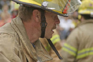 Bothell Firefighter Dave Seppa lends a hand during Bothell High’s annual drunk-driving simulation in 2006.