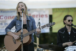 Playing her Loretta Lynn-autographed guitar