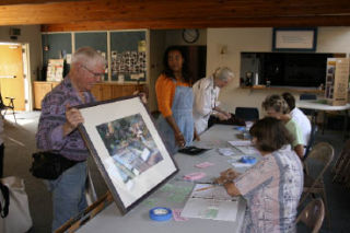 Clifford Burkey submits a painting for the Kenmore Art Show and Festival Aug. 15