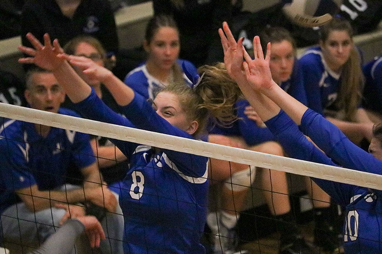 Bothell’s Gabby Kepley (8) and Sydney Cowan (10) go up for a block during the Cougars’ win over Mount Si in the first round of the KingCo tournament. Bothell won the tournament title on Saturday evening. JOHN WILLIAM HOWARD/Bothell-Kenmore Reporter