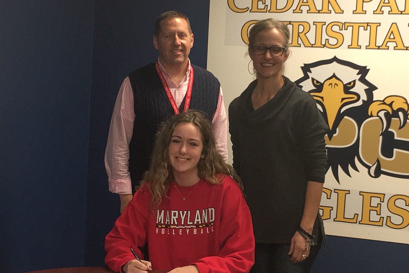 Sam Drechsel, pictured with her mother and coach Marni Drechsel and CPC Athletic Director Todd Lundberg, signed to play volleyball for Maryland on Nov. 9. Contributed photo