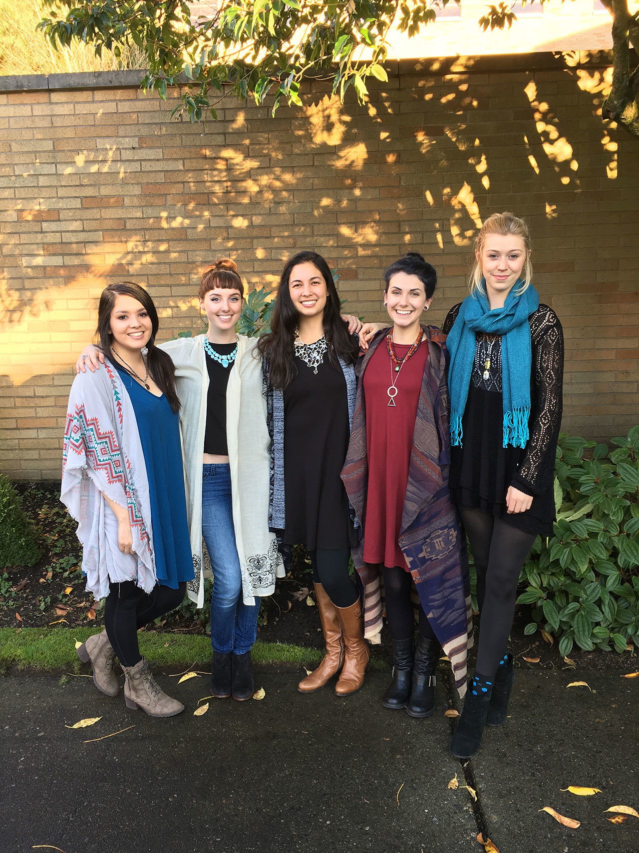 Members of the Se-lyn Boutique team pose for a picture. The store opens Dec. 3 on Main Street in Bothell. Contributed photo