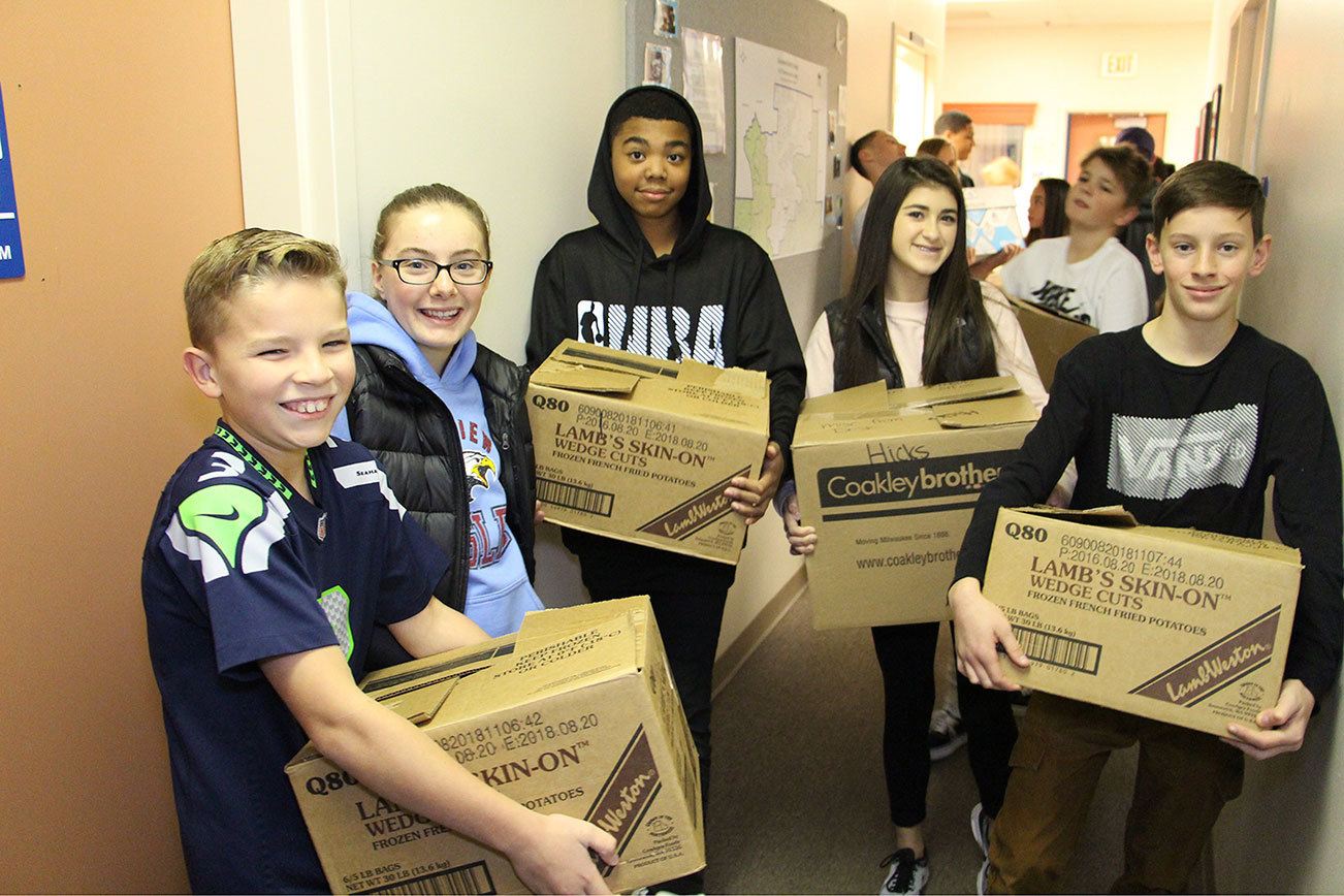 Skyview Junior High School kids collect donated food for their food drive. Contributed photo