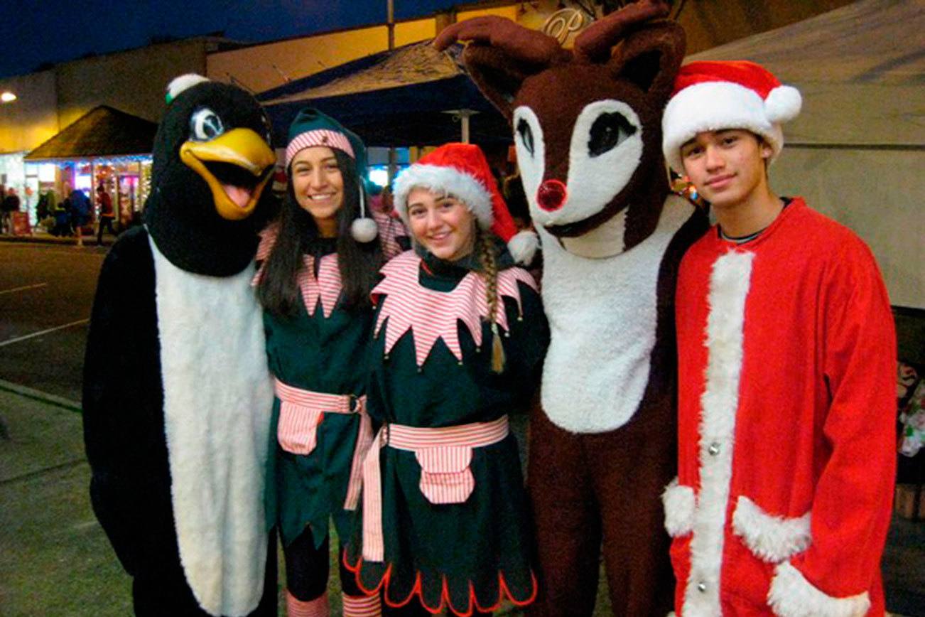 More than 65 students from Inglemoor and Bothell High Schools volunteered during the event. Five Inglemoor students are decked out in seasonal costumes provided by the Northshore Rotary.