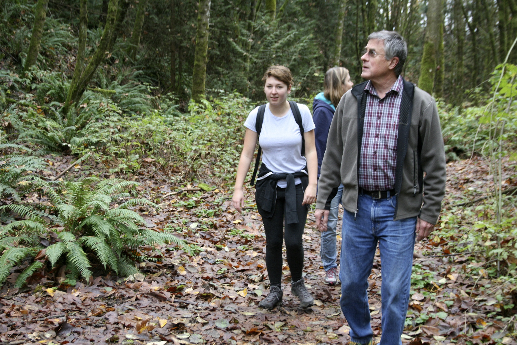Shelton View Forest Stewardship Association (SVFSA) board members Hillary Sanders (left), Cheryl Stanford and Bob Rorabaugh go on a hike through the forest. CATHERINE KRUMMEY/Bothell Reporter
