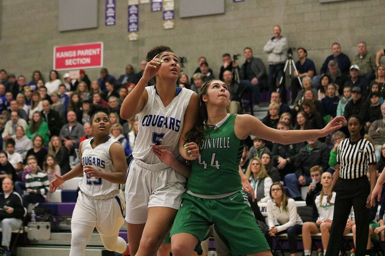 Bothell senior Taya Corosdale (5) and Woodinville’s Alena Coomer (44) battle for position during the 4A KingCo tournament championship game on Thursday in Kirkland. JOHN WILLIAM HOWARD/Bothell-Kenmore Reporter