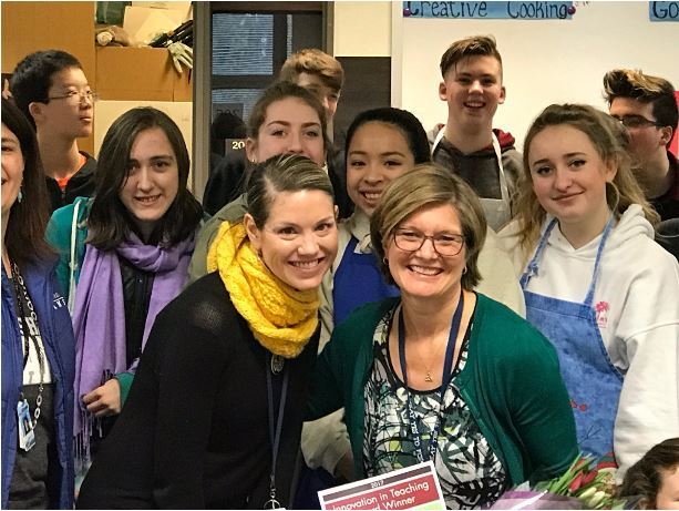 Northshore Junior High School Principal Tiffany Rodriguez, right, presents NSDF’s Innovation in Education Award to teacher Trudy Swain in her 9th grade home arts class. Contributed photo