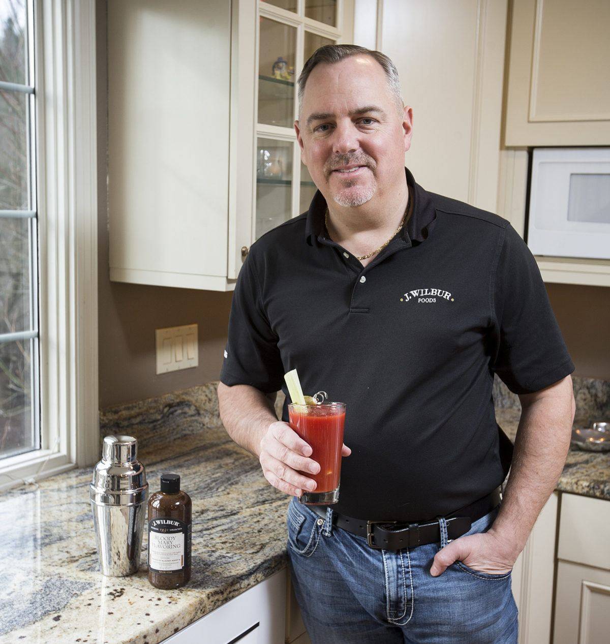 Andrew Holes is the founder of J. Wilbur Foods which makes three types of barbecue sauce as well as a bloody mary drink flavoring. Ian Terry/The Herald