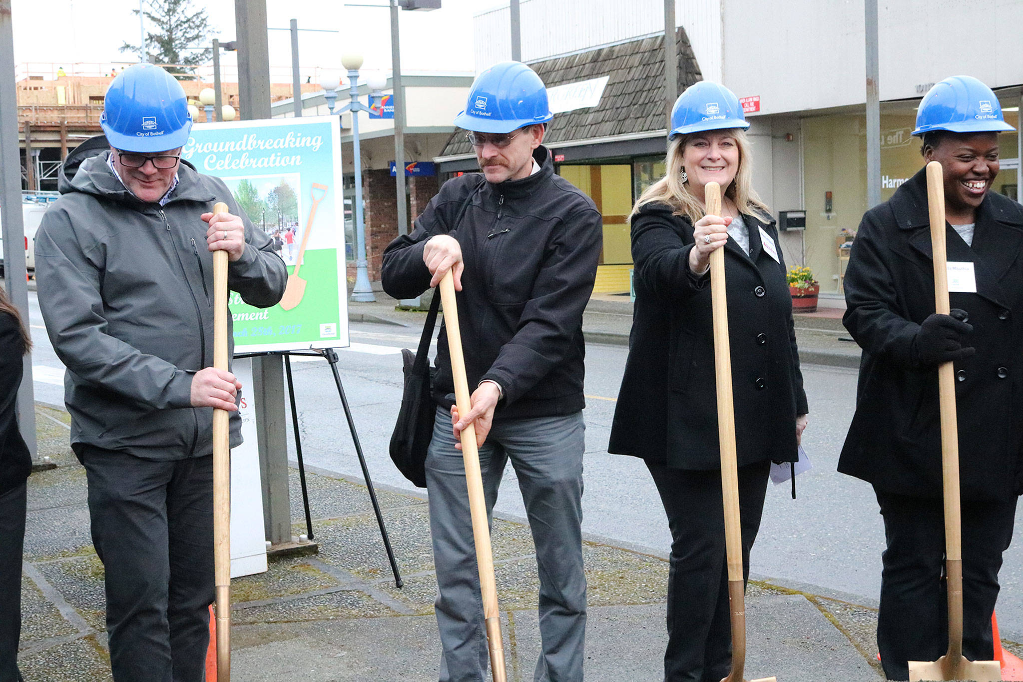 Bothell Mayor Andy Rheaume, Transportation Improvement Board Engineer Greg Armstrong, State Farm owner Nancy Pipinich and Bothell Senior Civil Engineer Nduta Mbuthia participate in the groundbreaking ceremony for the Main Street Enhancement Project on March 28. CATHERINE KRUMMEY / Bothell Reporter