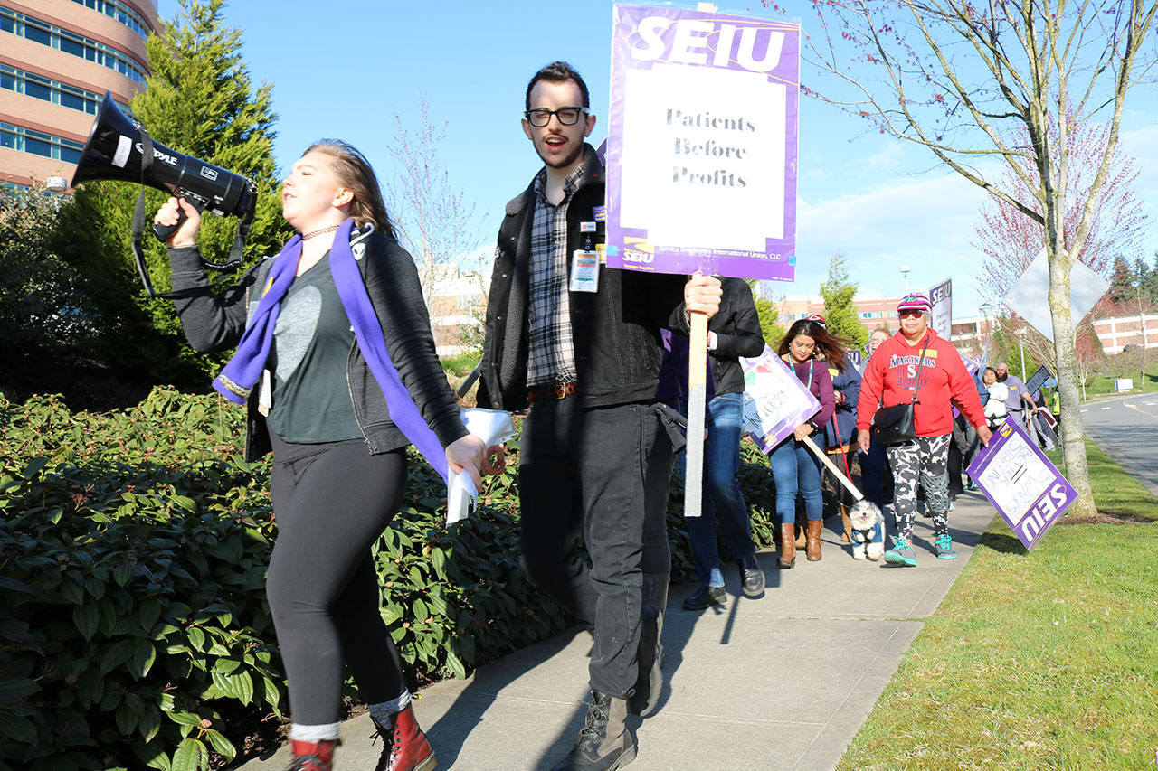 Employees of EvergreenHealth hold a rally for higher wages and better healthcare on Wednesday. MATT PHELPS/Kirkland Reporter