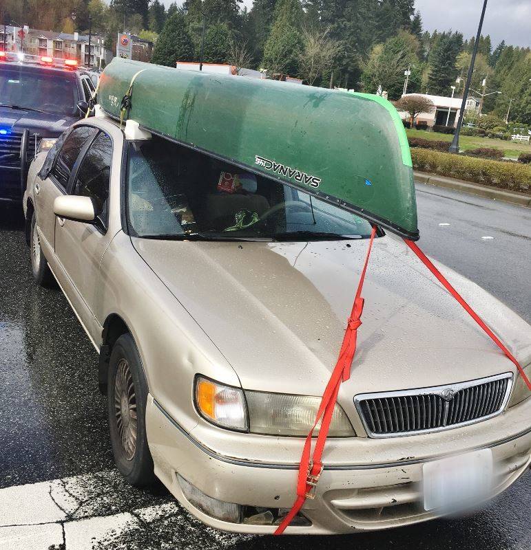 A Bothell business owner located his stolen canoe on top of the suspected thief’s car and called the police. Contributed photo