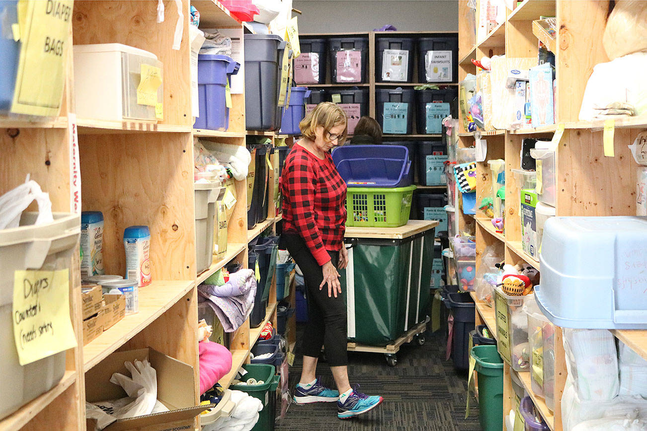 Kenmore resident Sue Cotner volunteers at Eastside Baby Corner - Northshore. A grand opening for the new Kenmore location will be held May 19. CATHERINE KRUMMEY, Kenmore Reporter