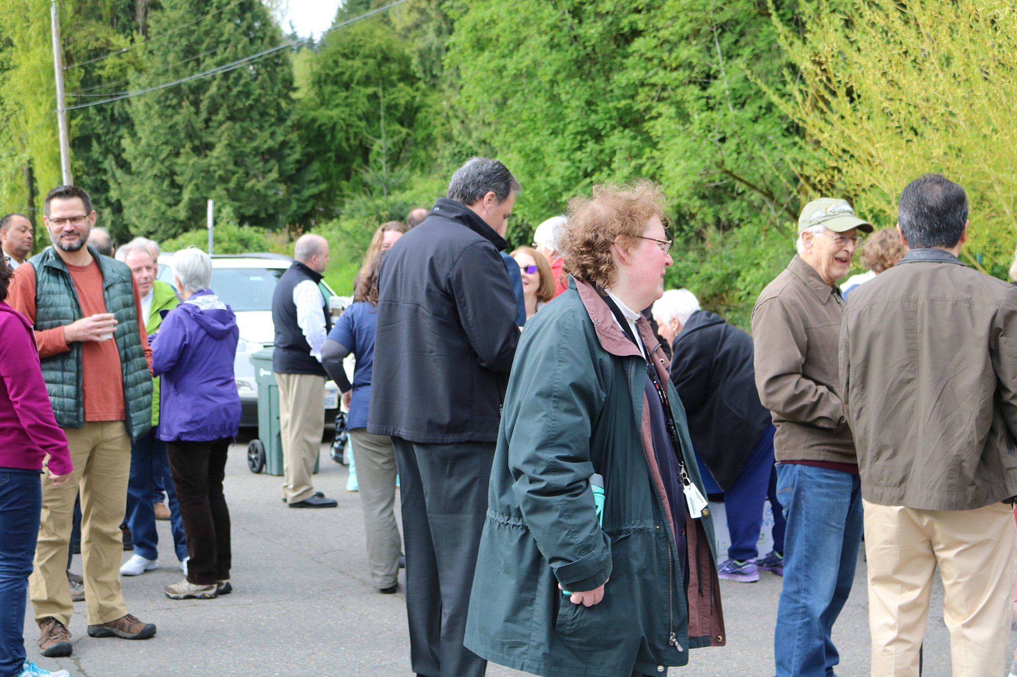 Attendees enjoy a continental breakfast provided by the Friends of the North Creek Forest ahead of the ribbon-cutting ceremony. CATHERINE KRUMMEY / Bothell Reporter