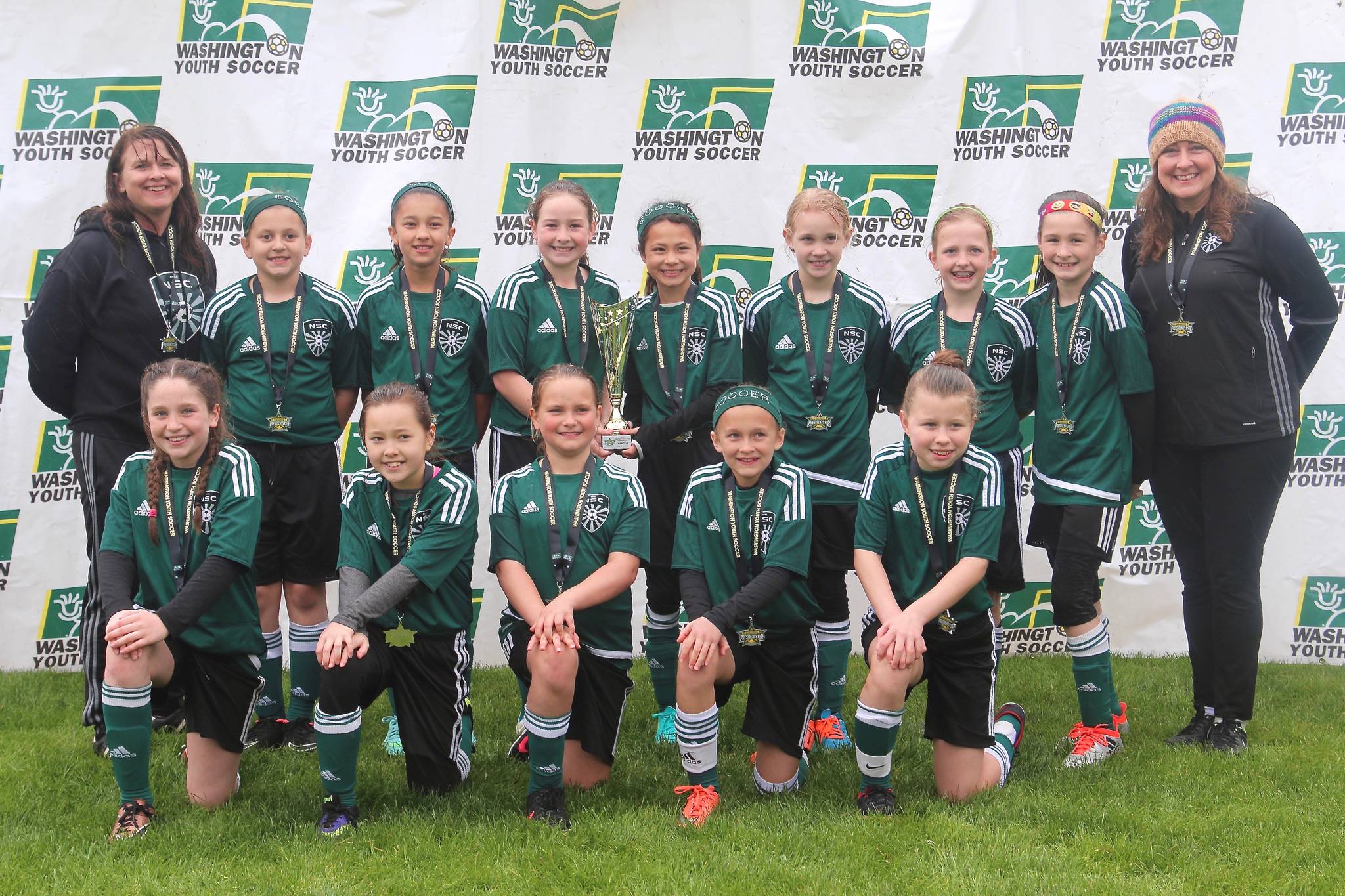 Northshore Select Club (NSC) Team Flash is: Back row (left to right) Coach Traci Carroll, Charlotte Lipkin, Malia McCoy, Addyson Bragg, Rayelle Landrum, Clarissa Siuda, Ellie Pedack, Alexis Smigelski and assistant coach Kristen Bragg; Front row (left to right) Sammie Thoma, Mackenzie Swanson, Anna Lunde, Natalie Carroll and Lilly Penhollow.