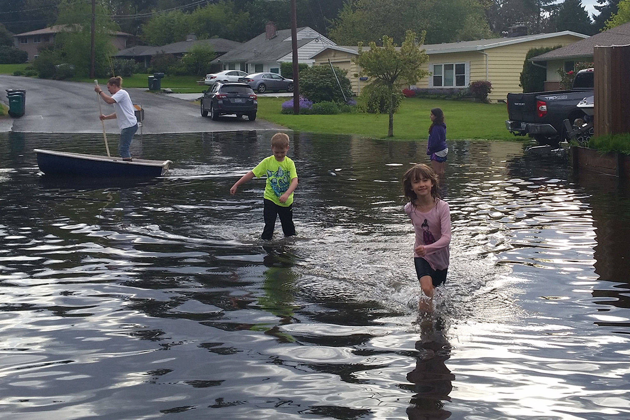 Local residents check out the water buildup near the intersection of 145th Street and 75th Avenue at the Kirkland-Kenmore boundary. Contributed photo
